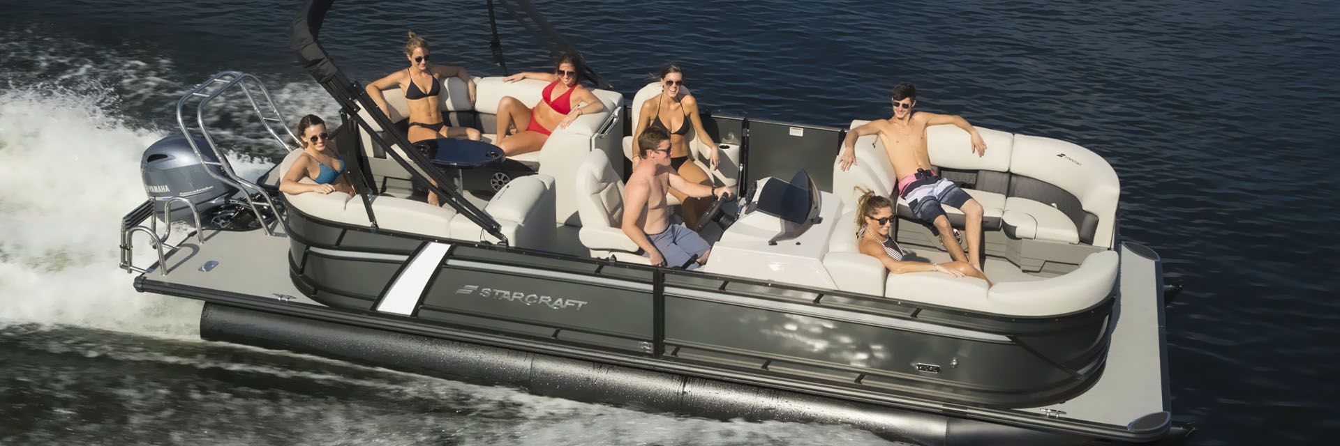 People riding on a Pontoon Boat